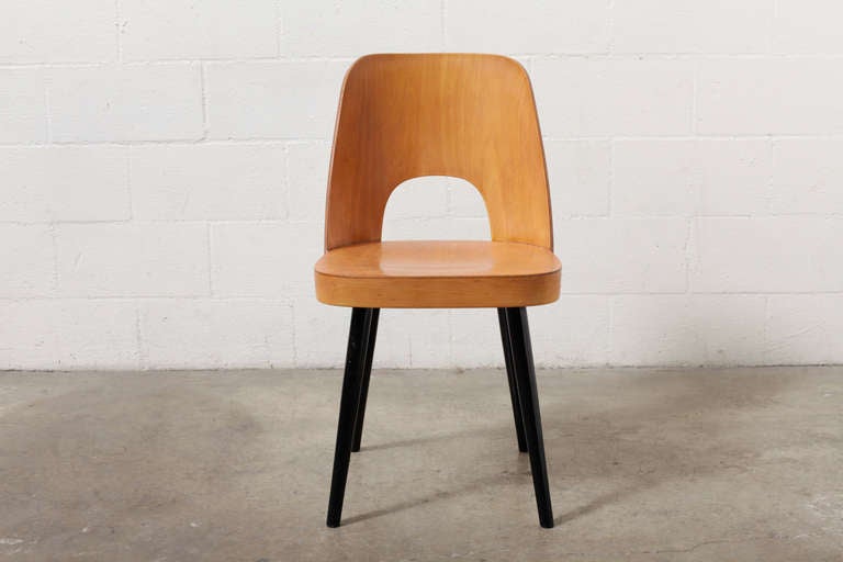 Designed by Oswald Hardtl, architect and designer and a pupil of Kolo Moser and later an assistant of Josef Hoffmann. Made of bent Beech plywood, formed back and ebonized legs. Sticker marked THONET. Normal traces of wear for its age and use.