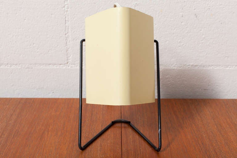 Pale Yellow Enameled Metal Triangular Shade with Black Metal Wire Frame.