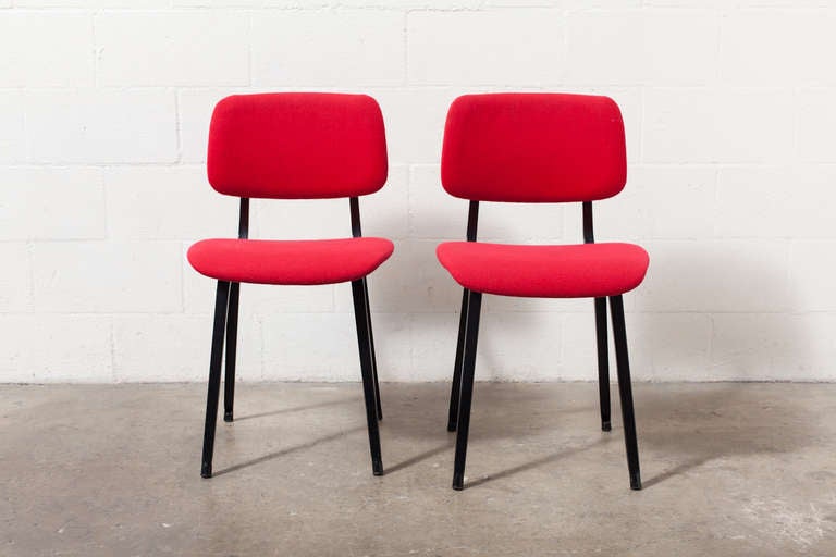 Original upholstered Revolt chairs in red with black enameled sheet metal frames.  In original condition.  Armed chair also available.  Listed Separately. Set price.