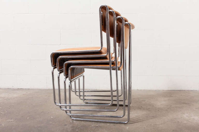 Newly upholstered in natural leather with tubular chrome frame. Beautiful profile and use of negative space. Set of 4 stacking chairs. 1940's attr. Frame in original condition. Set price.