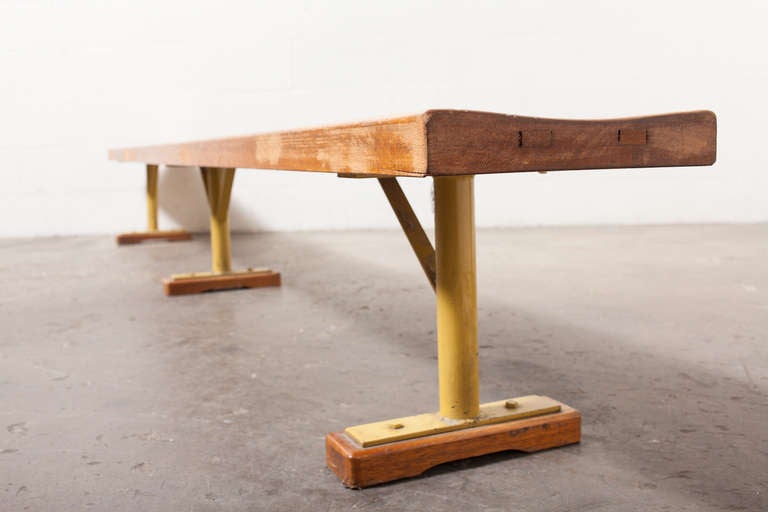 Extra long solid oak gym bench with steel architectural supports.