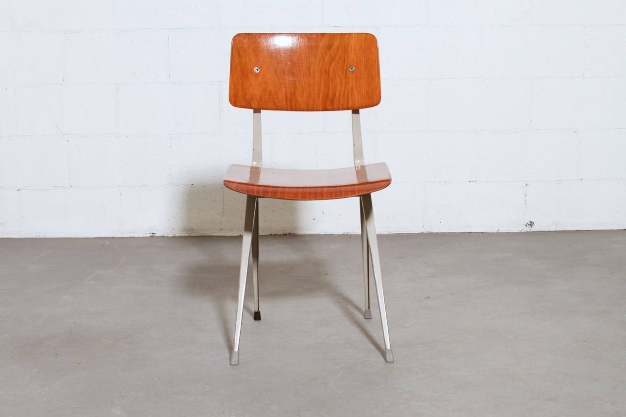 Later Edition Plywood Seat and Back with Iconic Enameled Grey Folded Sheet Metal Frame with Ahrend de Cirkel Engraved on Frame. Plywood Color Varies Slightly in Each Chair. Wood is in Very Good Condition with Slight Rusting on Frame. Set Price. One