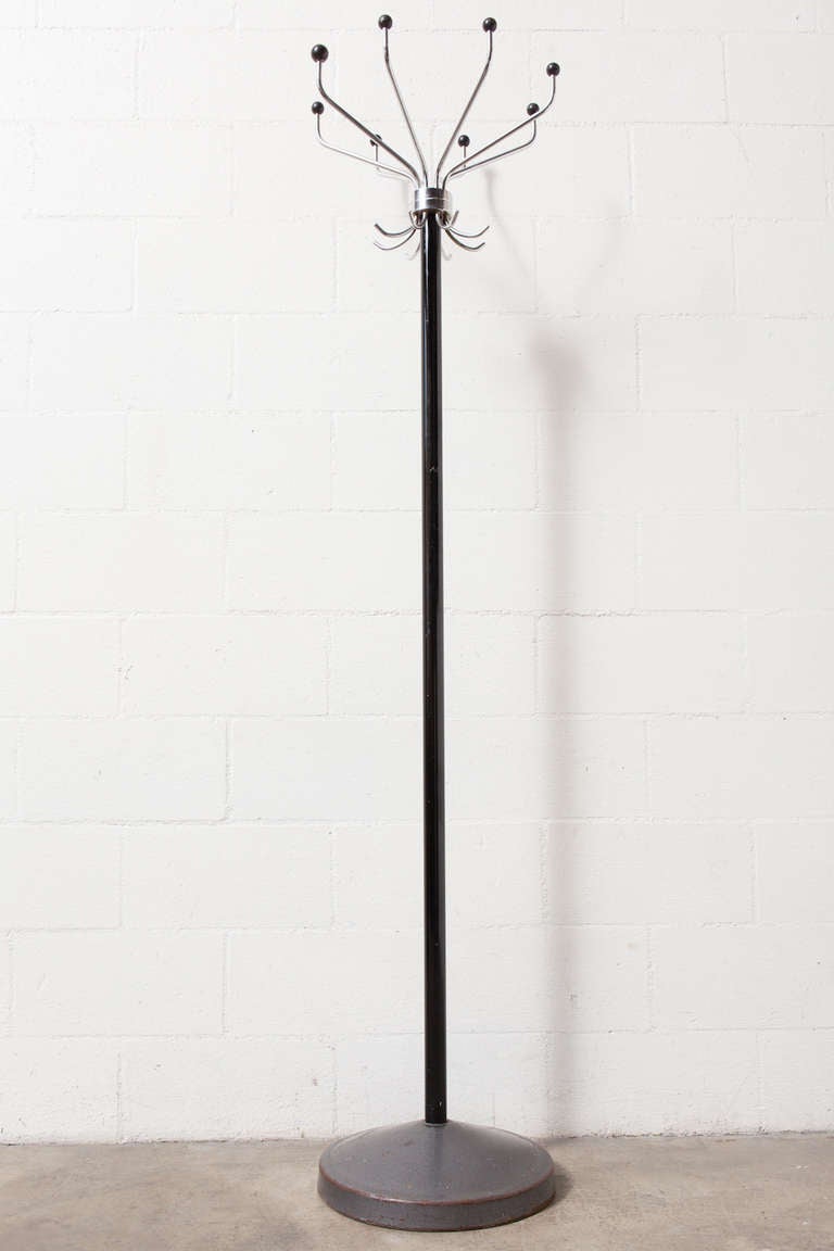 Weighted Cast Iron Base with Enameled Black Metal Pole and Spinning Chrome Top with Round Black Tipped Hooks.