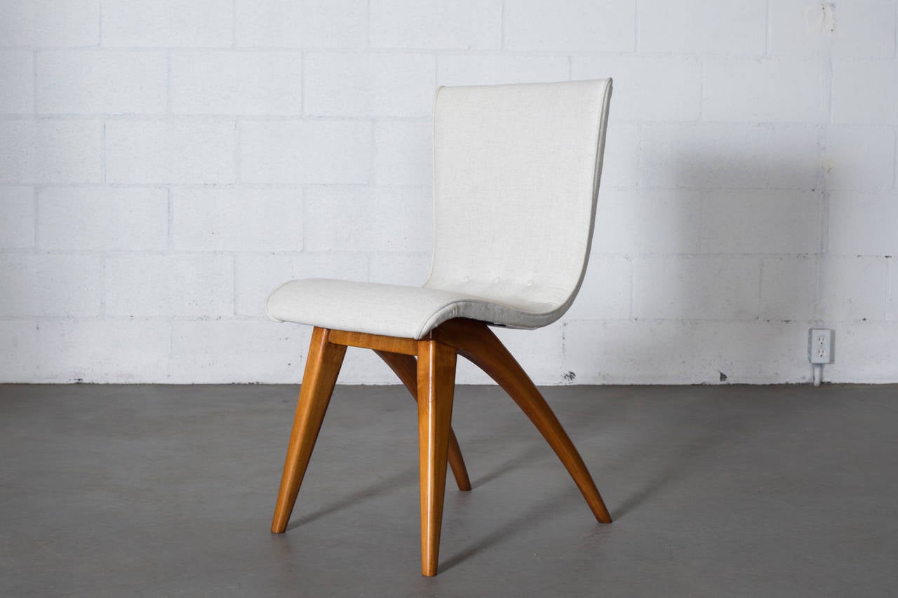 Beautiful Swooping White Upholstered Dining Chairs by Van Os (Culemborg) with Curved Legs in Blonde Teak. Frame in Good Original Condition with New Bone White Upholstery.