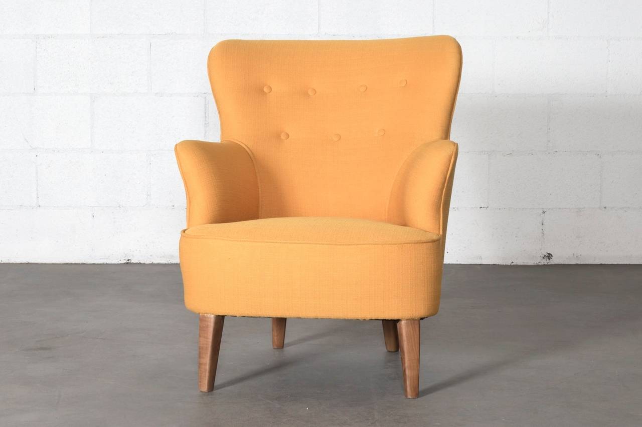 Vintage Theo Ruth lounge chair, circa 1956 with full curves. Frame is original, newly upholstered in sunshine yellow fabric. Theo Ruth was an interior and furniture designer whose most famous design was his 1952 congo chair based on innovative