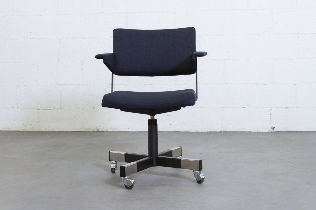 Newly Upholstered Navy Rolling Office Chair By Gispen with Adjustable Seat Height. Frame is in Original Condition with Slight Wear to Enamel Consistent with Age and Use.