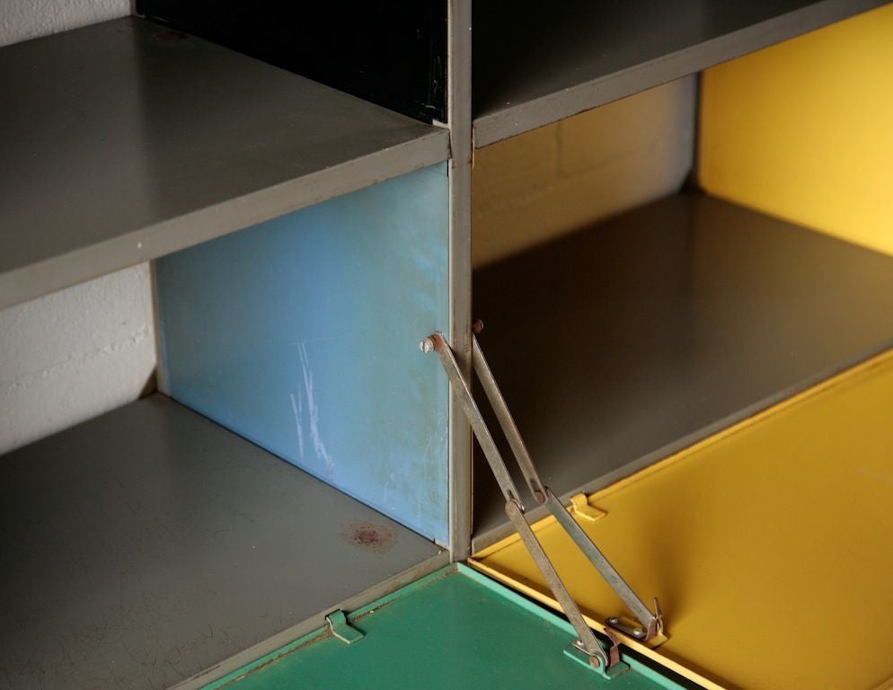 Designed by Wm. Rietveld (1924-1985) son of Gerrit Rietveld, made of of Multi-Colored Enameled Metal. This Rare Industrial Bookcase Wall Unit with Built-in Drop Down Desk is a Modular Unit that one can build bigger. Also Available is a 1 Section