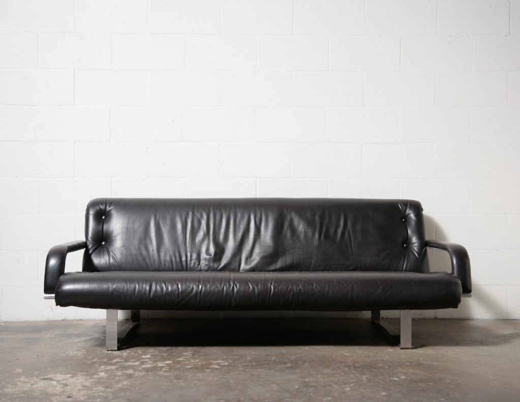 Love Seat and 3 Seater Sofa in Cast Aluminum Frame with Original Black Leather Upholstery. The Leather is Original and Worn Nicely with Some Cracking, the Love Seat Measures 53.5