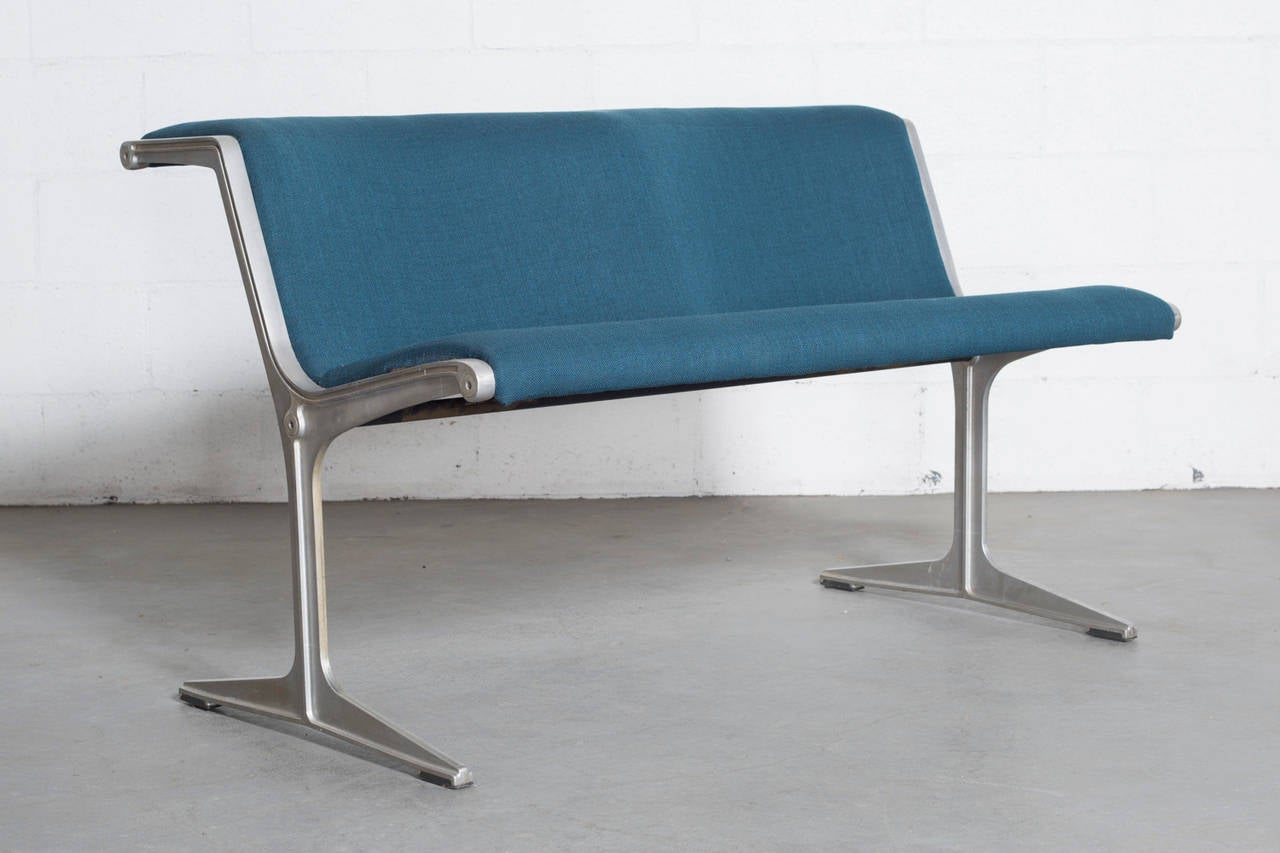 Polished aluminum two-seat bench with fiberglass seat back and new blue upholstery. This famous bench system was designed by the Dutch designer Friso Kramer but manufactured by Wilkhahn (Germany) and in production from 1968-1988. The bench system