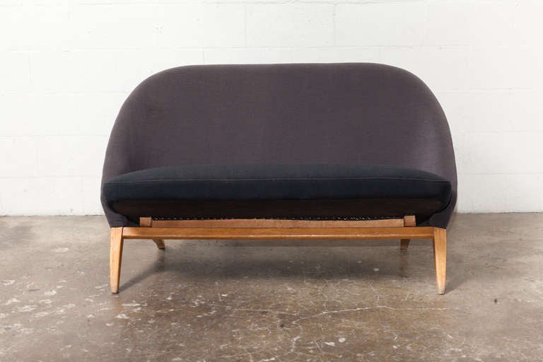 Beautiful sofa set designed by Theo Ruth. Both use unique tension set construction. Seat and back are two separate pieces that fit together like two pieces of a puzzle. Original finished wood frame and upholstered seat and back. Set price. Chair