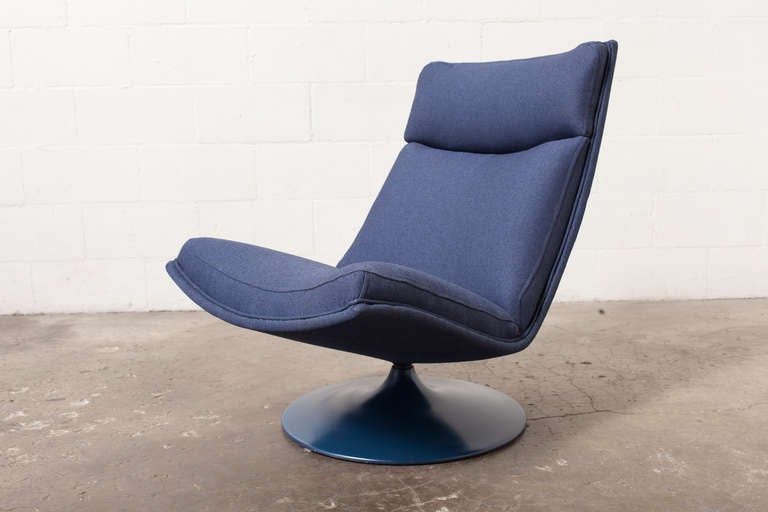 Great Armless Swivel Lounge Chair with New Navy Upholstery and Enameled Metal Blue Base.