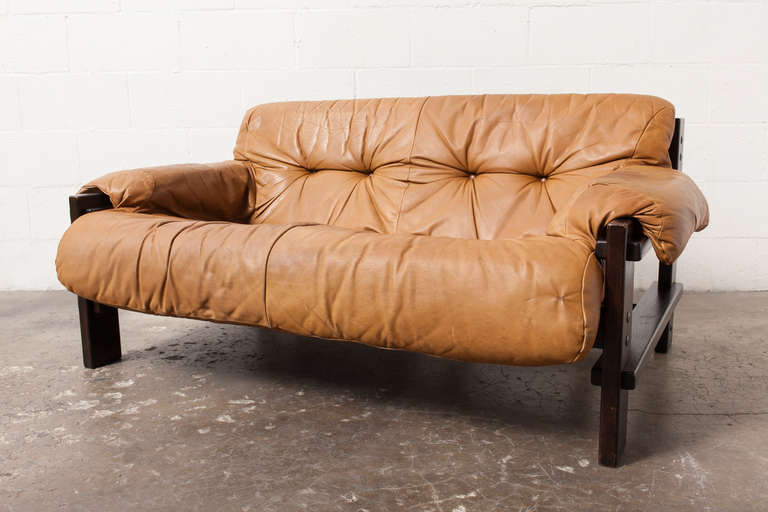 Gerard Van Den Berg for Montis 1970-72 Two-Seater Camel Colored Leather Sofa with Nice Patina and Dark Finished Wenge Wood Frame and Sturdy Natural Leather Strapping . Also Available are a Single Tri-pod Lounge Chair and a 3 Seater Sofa