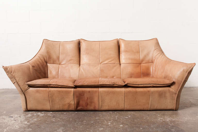 Three-seater natural buffalo leather sofa for Montis, 1970s. Extremely thick and strong leather with visible fading of color, nice patina. Also available is a two-seater matching love seat (S185 DVR2).

Gerard van den Berg arguably defined a