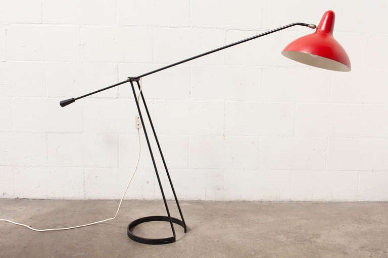 Artimeta Soest Red Enameled Metal Hood with Black Wire Frame by Floris Fiedeldij, 1956. Brass Hardware. See-Saw Mechanism. Original Condition, Some Denting to the Shade, Some Paint Loss. Extends to depth of 55" and up to height of 63"