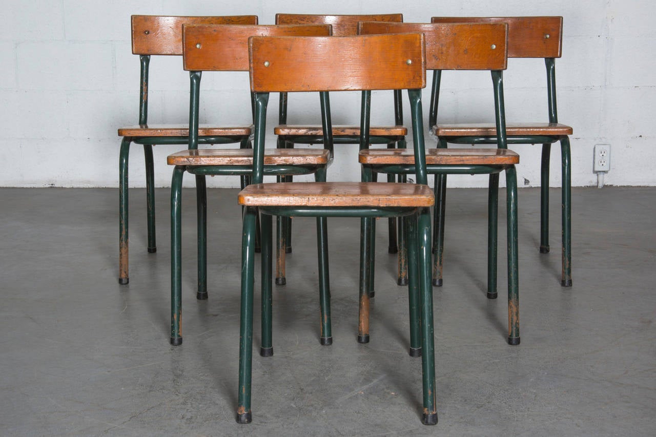 Attributed to Willy Van Der Meeren, 1954-1957 production, Belgium. Rustic, with great patina, these thick tubular metal framed chairs have solid oak seats and backs. Set of six price.