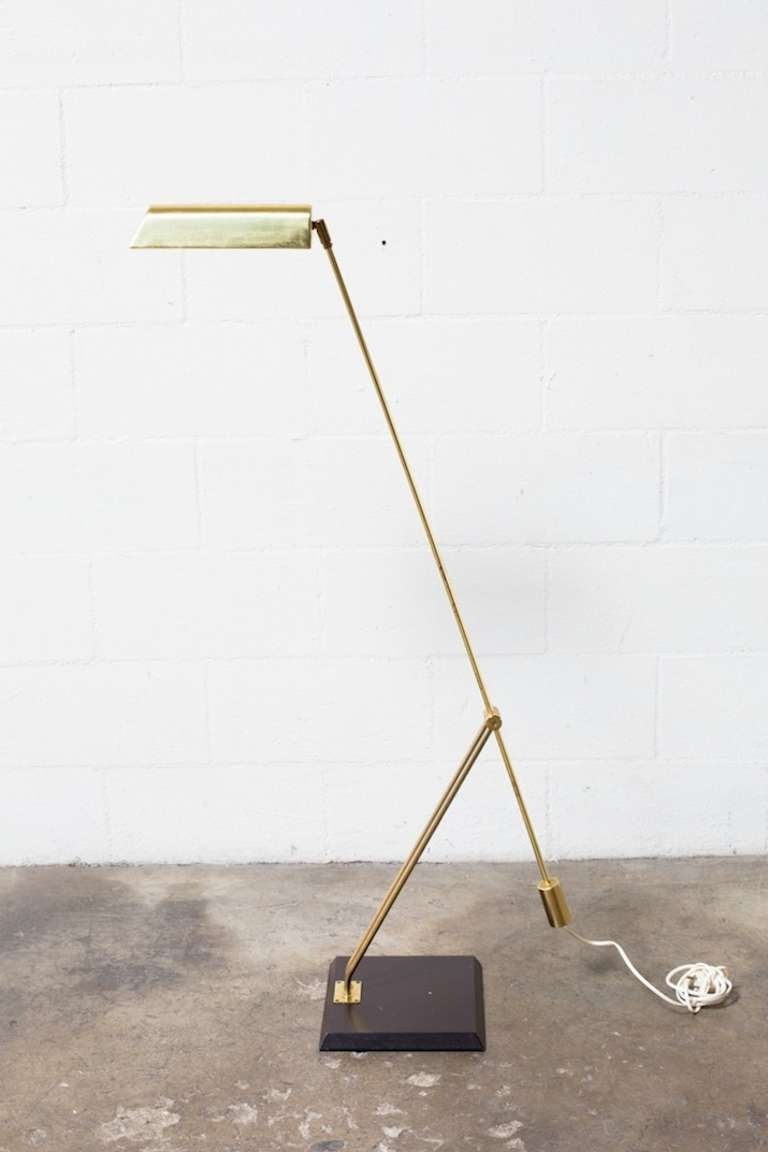 Delicate Brass Tubular Floor Lamp with an Elongated Shade and Counter balance weight mounted on a Beveled Wood Base