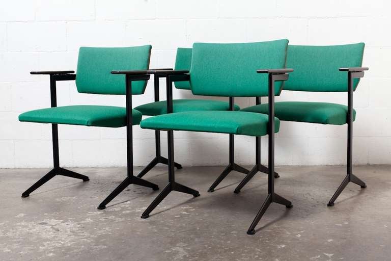Metal Framed Arm Chair with Refinished Rosewood Seat Back and Arm Rests in Original Green Upholstery and Prouve Style Legs. Available in both light (1) and dark emerald green (4) upholstery. Needs reupholstery. Priced Individually.