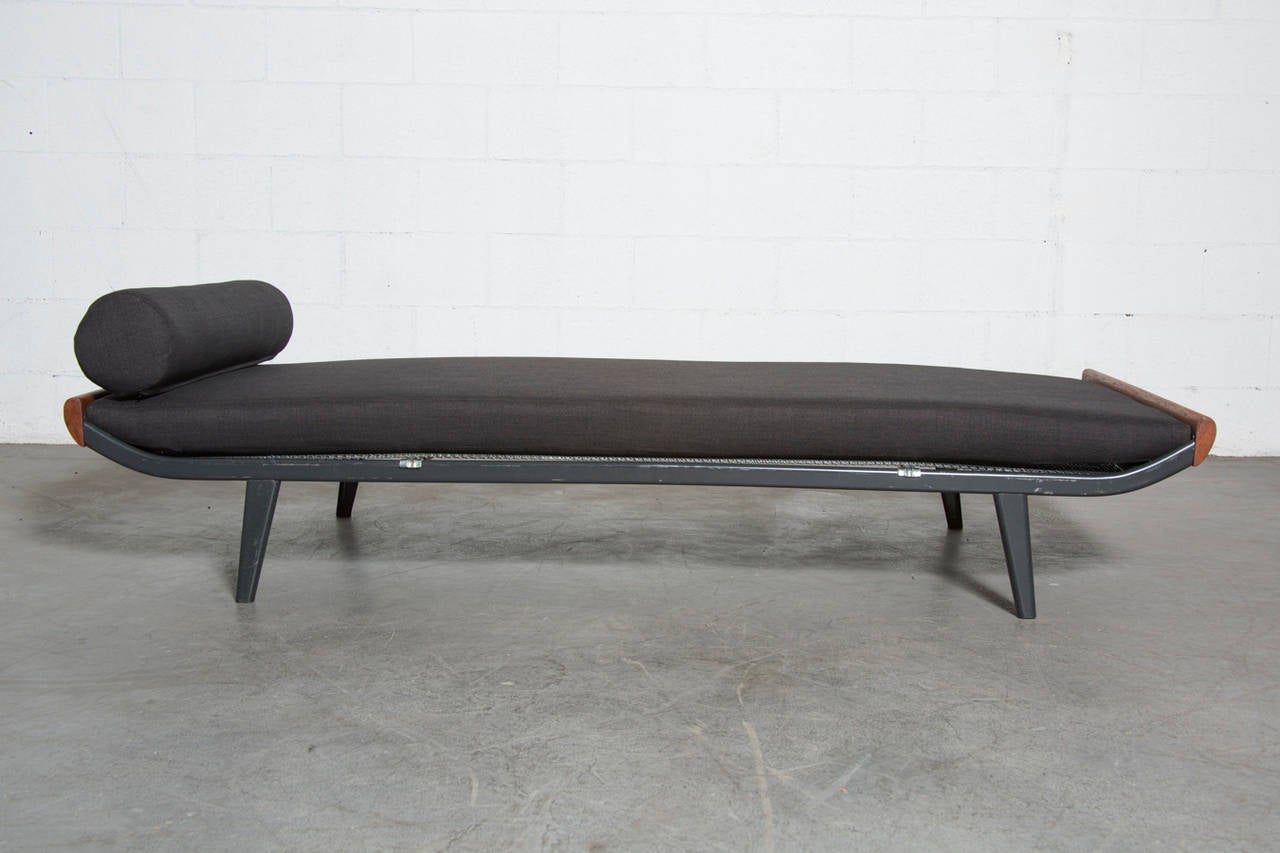 Cleopatra daybed by A.R. Cordemeijer for Auping, 1960s with solid teak ends and almost black enameled metal frame with matching almost black custom-made mattress and bolster. Frame in original condition with visible signs of wear and scratching.
