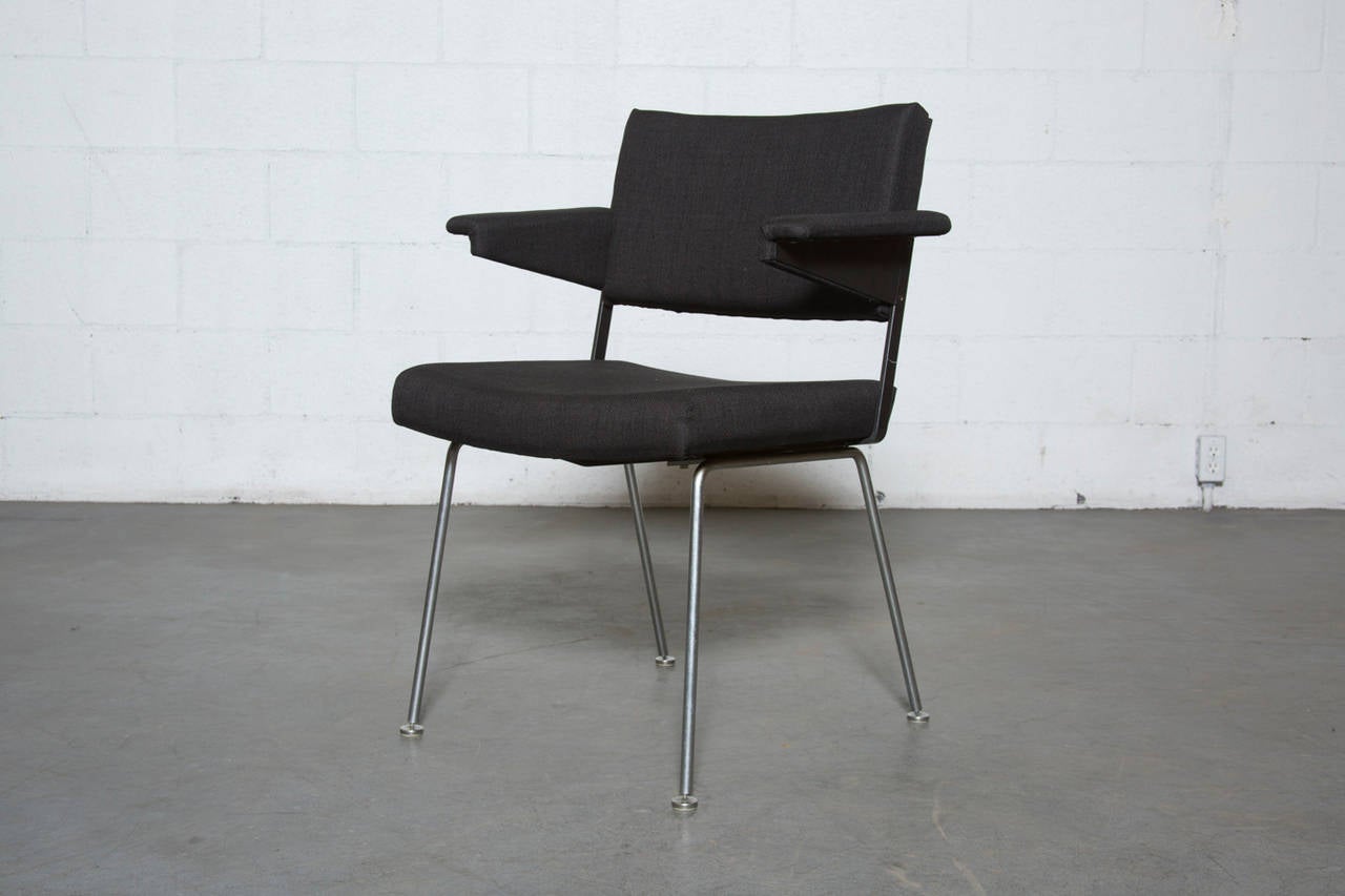 Great architectural chair in new almost black fabric with wide body, Prouve style armrests, black enameled metal frame and brushed steel legs. Frame in original condition. Set price.