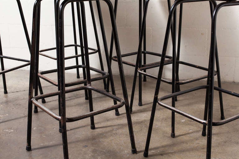 High back rattan and chrome bar stools with black enameled metal frame. Nicely patina-ed wicker. Sold in sets of 2.
