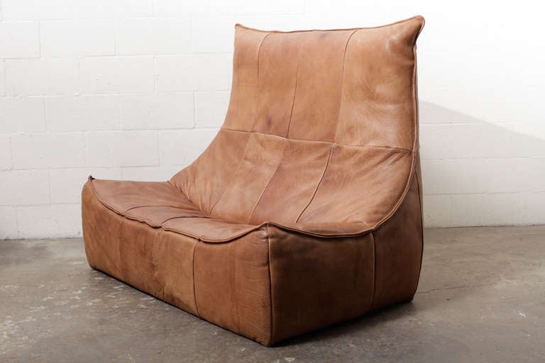 Super comfortable two seater leather sofa designed by Gerard van den Berg for Montis 1970 in natural leather.