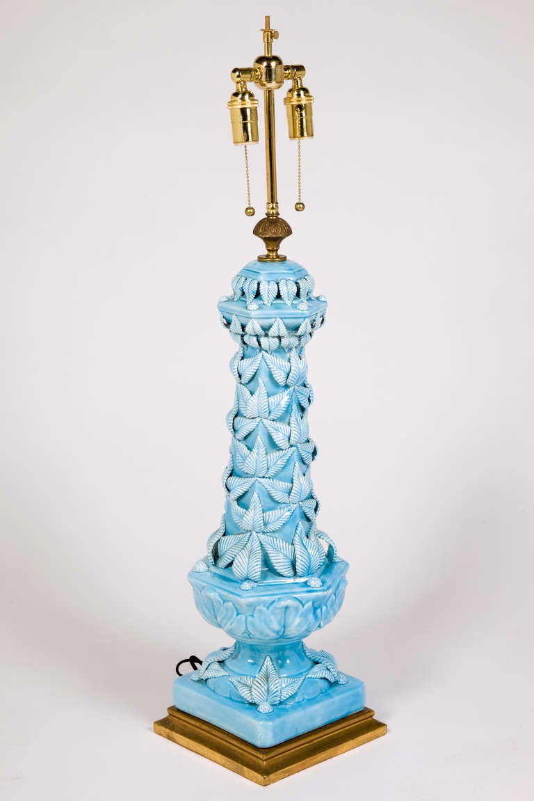 Ceramic 1950s French table lamp with blue glaze on gold base and adjustable harp. Two bulb illumination with chain on/of, circa 1950.