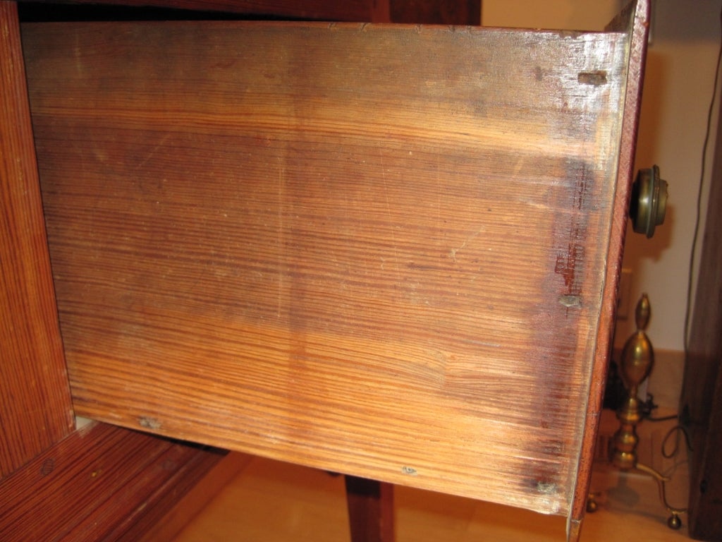 Antique Southern hunt board/sideboard with two drawers, tapered legs, and constructed of yellow pine using wooden pegs.

This hunt board is in very good condition, showing only the wear expected from its age and usage. 19th century, Southern U.S.A.