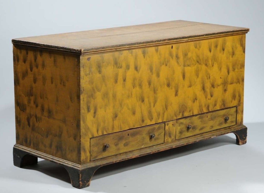 Chippendale paint decorated blanket or dower chest. The chest retains its original yellow paint with smoke decoration and black trim. There are two side-by-side drawers at the base. Circa 1800-1820.