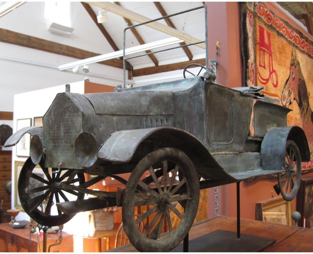 A rare copper car weathervane, with a hand-made model of a pre-1915 Model T Roadster convertible pickup truck.

The patina is excellent, as are the details on the car. Note the vanes on the wheels, indicating that the wheels were made to turn in