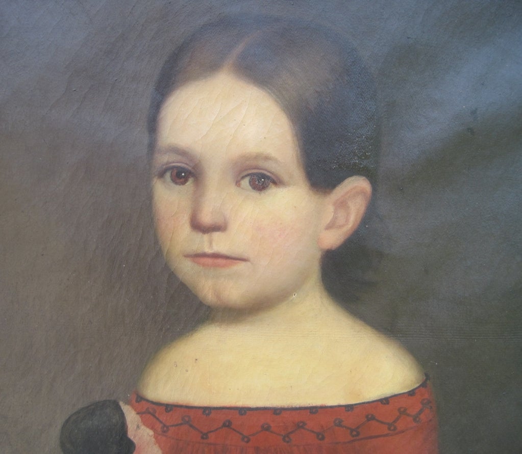 Endearing naive portrait of a young girl in a red dress holding her doll, oil on canvas, unsigned. Circa 1840, American School.