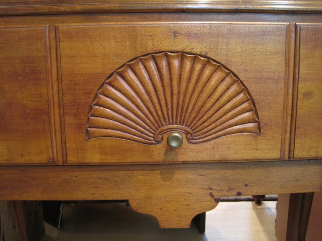 Queen Anne cherry highboy with fan carving. This highboy boasts attractive cabriole legs and pad feet, nicely dovetailed drawers and the original brasses. It is in excellent condition. The highboy dates from the mid-18th century and was made in