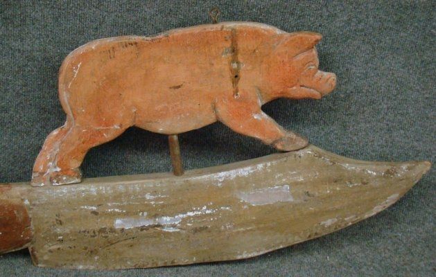 Carved wooden butcher’s trade sign, painted on both sides. <br />
This unusual and well-carved sign features a butcher, a pig and a knife. There is natural weathering to the paint and minor restoration of the paint on the upper surfaces of the pig