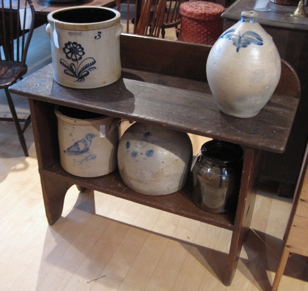 Bucket bench, pine, with mortise and tenon construction on the top and sides. The bench has a very attractive old patina. It dates from the early 19th century and was found in New Hampshire. The bench looks equally good standing alone or as a