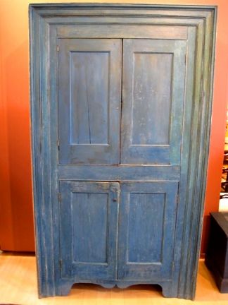 This is a beautiful early Hudson Valley four-door cupboard in original blue paint. The cupboard boasts exceptional triple-stepped picture frame molding, and a beautiful cut-out base. Circa 1800, New York State origin.