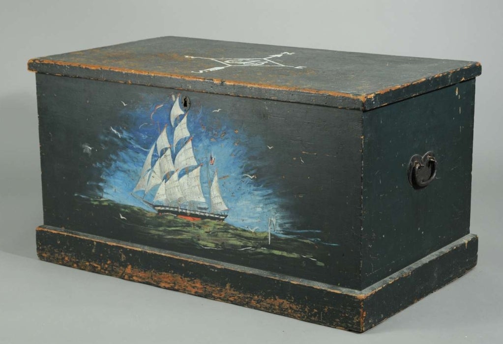 Sailor’s chest in original blue paint, with hand-forged iron hinges. The chest is decorated with a beautiful painting of a sailing ship on the front panel and a compass with the initials “EB” on the lid. These decorations are not original, (probably