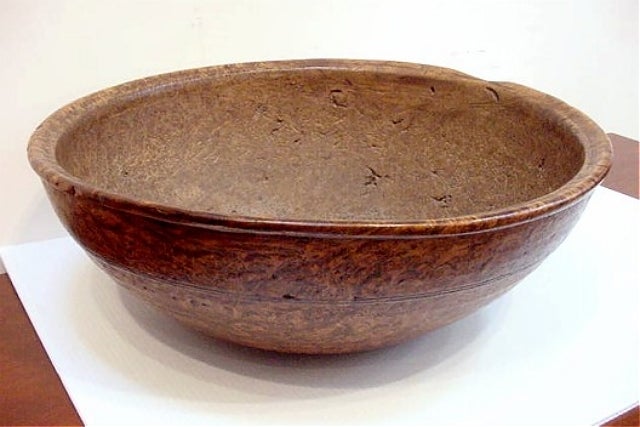 Early 19th century large round American burl bowl having beautiful coloration, excellent figuring, and wonderful patina.