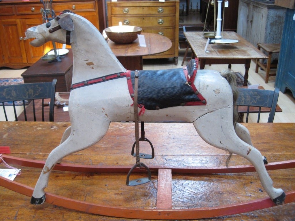 Beautiful child's rocking horse in original paint, with a wonderful sculptural quality. 19th century, and a real charmer.