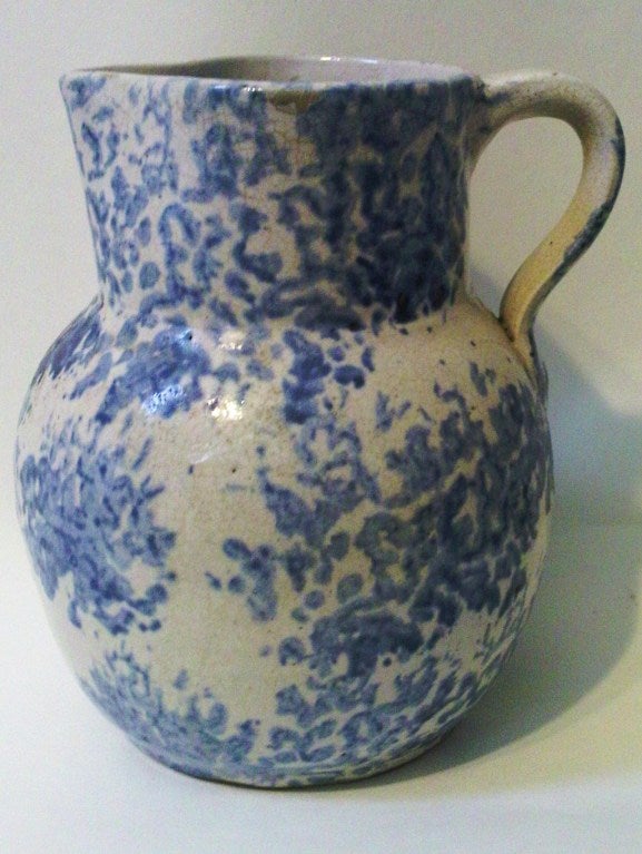 Produced by the Uhl pottery in Huntingburg Indiana.  This is the middle size of this distinctive form.  A softer look to the sponging than the traditional cylindrical form from Ohio and Pennsylvania.