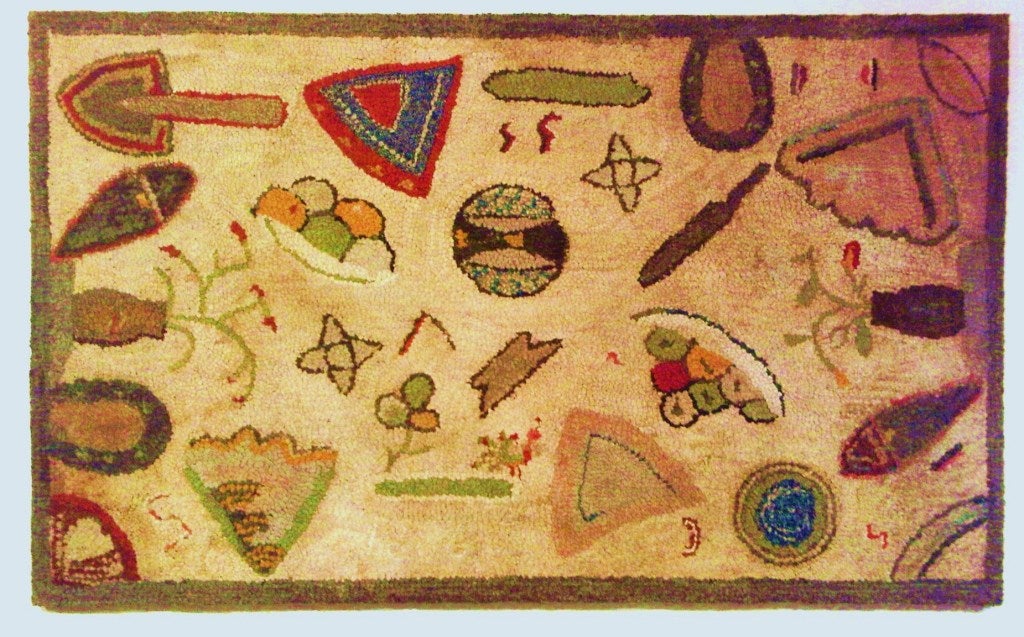 A true piece of folk art, this rug with floating motifs of the farm and daily life.  Faintly striated background with multicolored symbols..horseshoe, pie slices, an anvil and a trowel, etc. The date is in white, shown in the second photo.