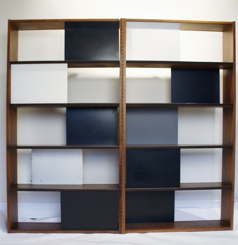Room divider or bookcase designed by Evans Clark for Glenn of California features a folding hinge and sliding panels.  Can be used as a 60