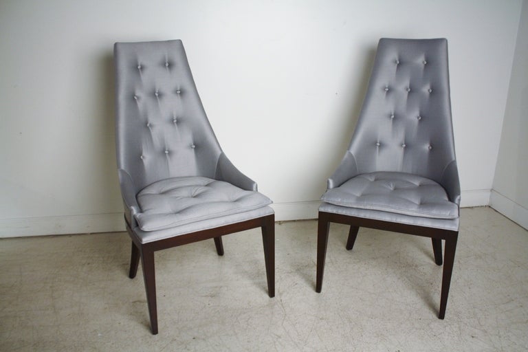 Very stylish and rare 1950s restored walnut high back barrel chairs by Drexel reupholstered in a blue/gray shantung fabric.  These are ideal as slipper chairs or captain chairs for dining