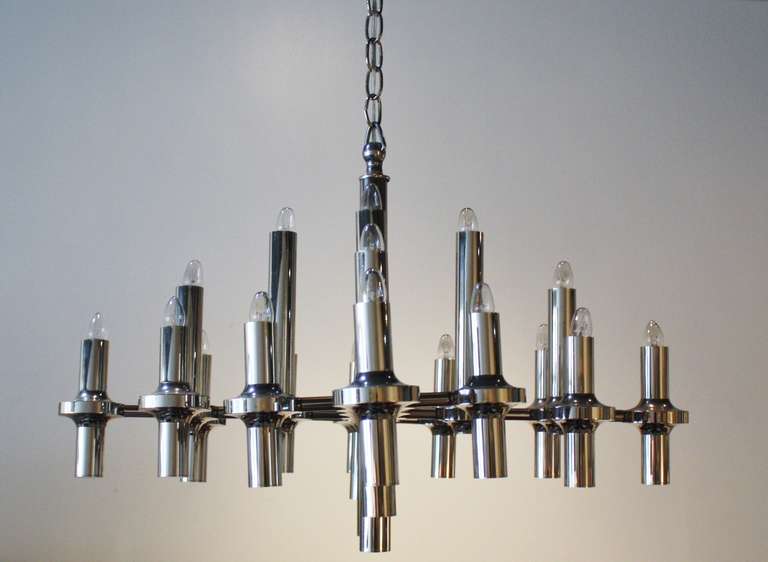 Modernist twenty-light chrome fixture hangs from metal chain attributed to Gaetano Sciolari. Newly wired and all sockets in working condition. Measures: 48