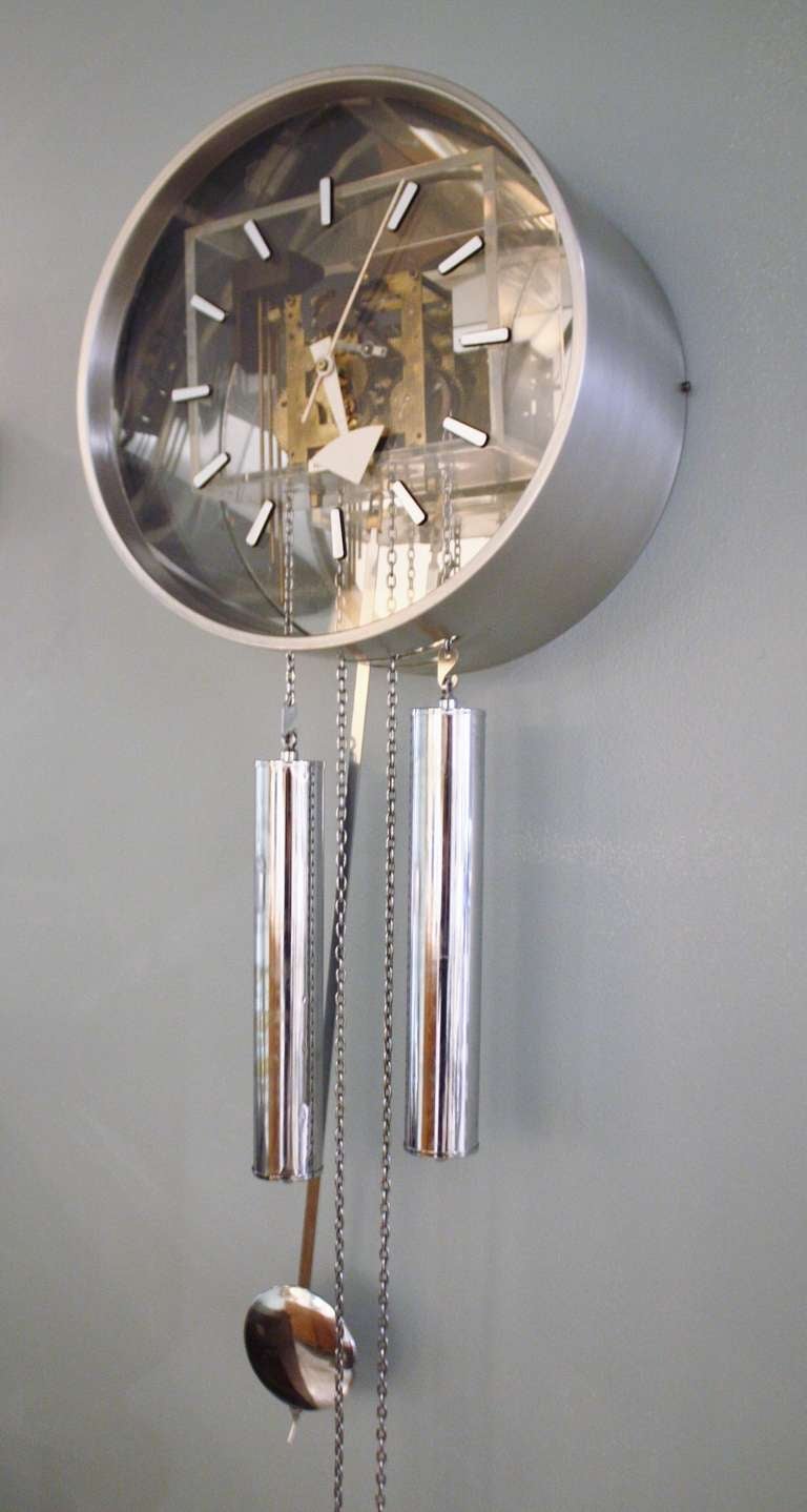 Iconic skeleton chrome wall clock designed by George Nelson for Howard Miller.  Works and chimes every hour and half hour.
