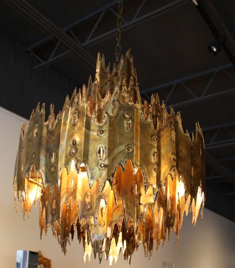 Brutalist chandelier designed by Tom Greene for Feldman Co. 1960s.  This example has the crown on the top layer.  See the other example in our storefront.