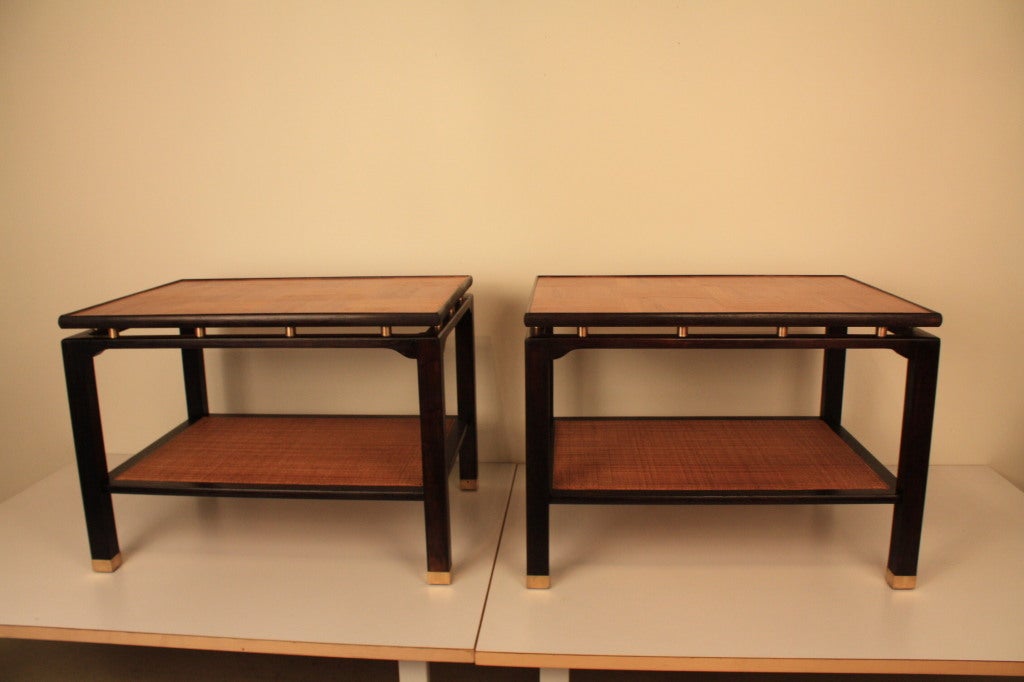Pair of two-tiered end tables beautifully refinished in two-tone chocolate finish and restored parquet and cane shelves.
