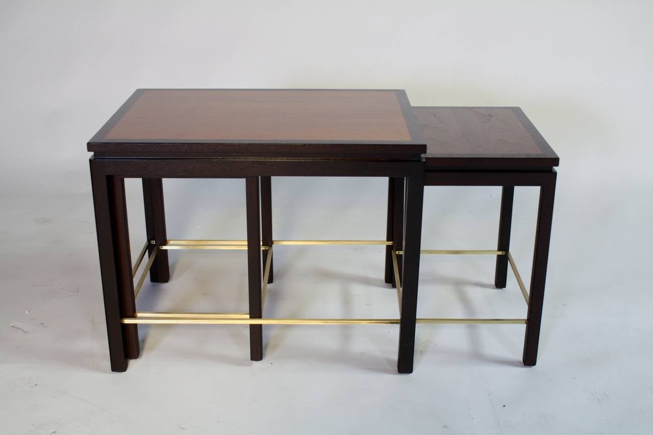 Beautifully restored set of three nesting tables by Edward Wormley for Dunbar in mahogany with brass stretchers.