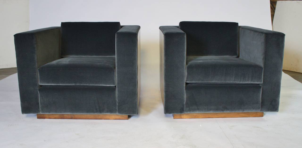 Stunning pair of Mid-Century cube club chairs by Milo Baughman beautifully reupholstered in charcoal gray with restored walnut frames.