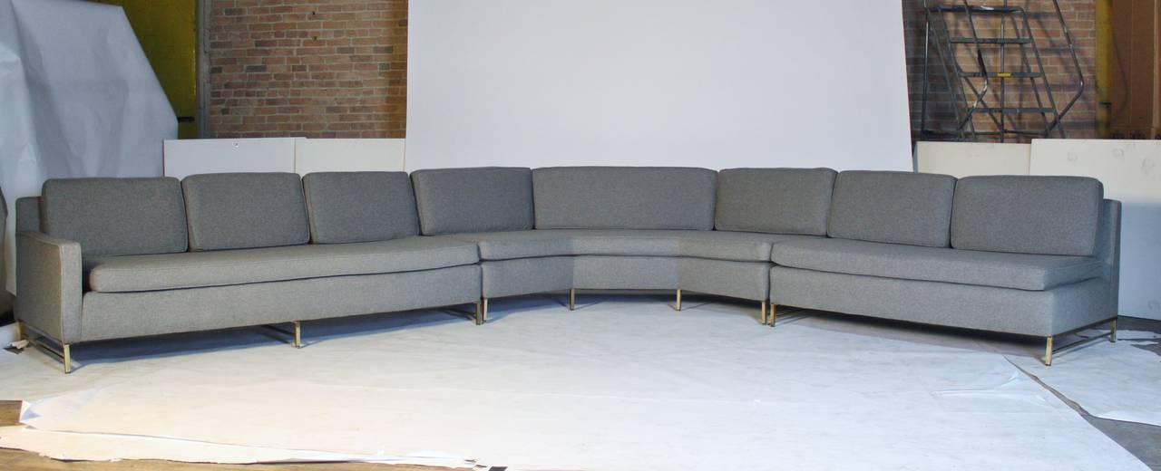 Remarkable mid-century modern 3-piece sectional sofa by Paull McCobb for Directional upholstered in gray wool fabric on brass frame. Middle sectional measures 84.5"L x 32"d x 32"h seat height 17.5, left one-arm end sofa measures