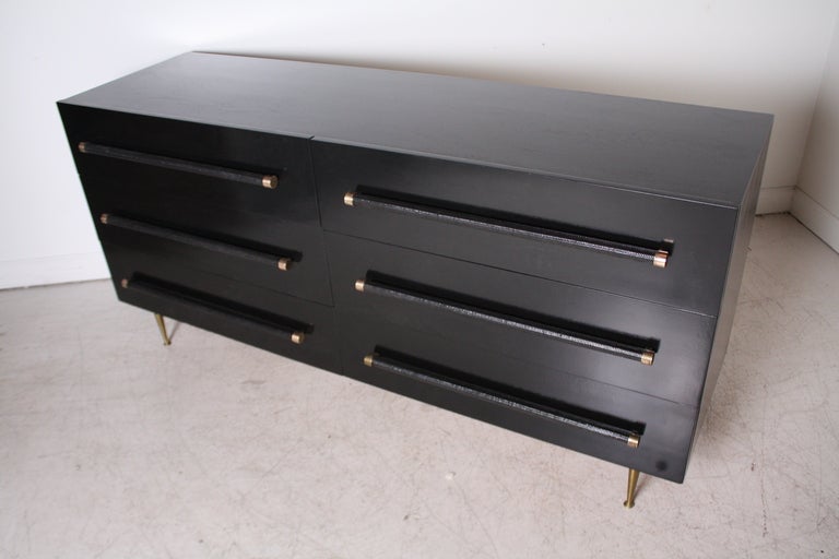 T.H. Robsjohn Gibbings 6-drawer dresser by Widdicomb lacquered in black with rattan and brass handles and brass tapered legs.
