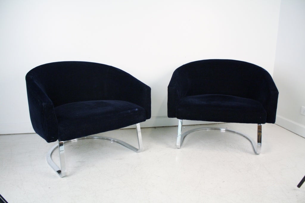 Pair of wide barrel back tub chairs in deep cobalt blue mohair on heavy chrome steel sled legs.  In the style of Milo Baughman, possibly made by Pace.